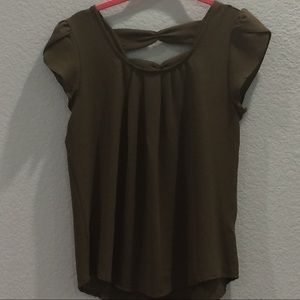 A army green shirt with bows on the back.